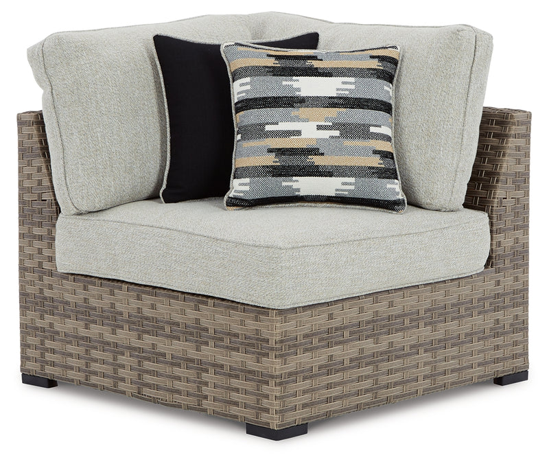 Calworth Beige Outdoor 9-Piece Sectional With Ottoman