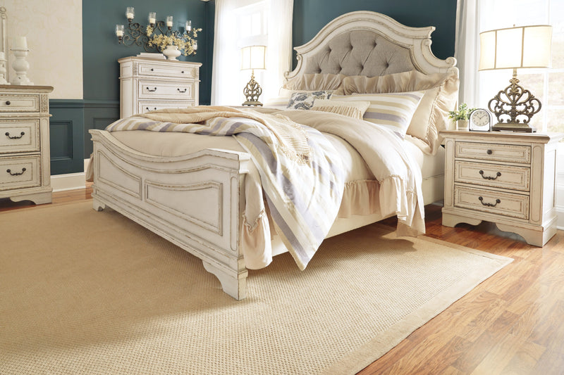 Realyn Chipped White King Upholstered Panel Bed