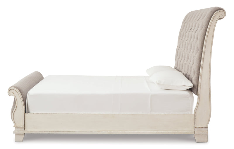 Realyn Chipped White King Sleigh Bed